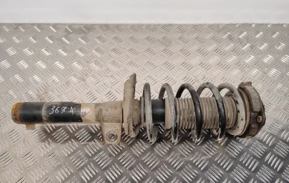 Volkswagen Caddy Front shock absorber with coil spring