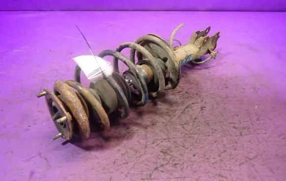 Nissan Almera Tino Front shock absorber with coil spring