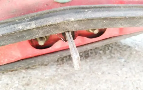 Front door check strap stopper