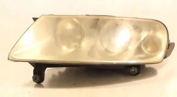 Volkswagen Touareg I Headlight/headlamp 7L6941015BA