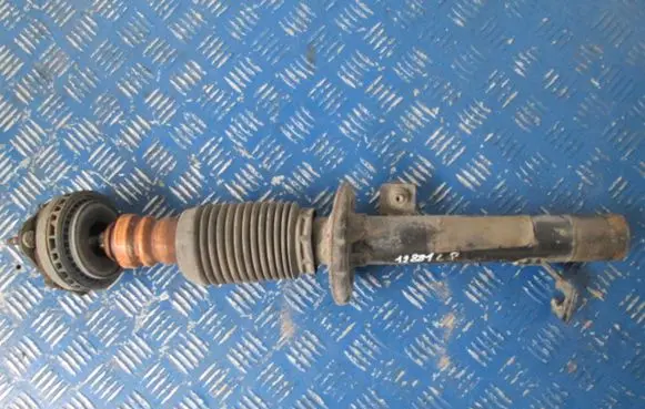 Mazda 323 F Front shock absorber with coil spring