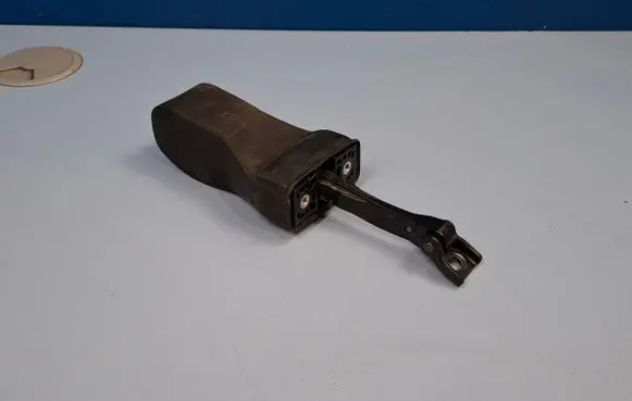 Front door check strap stopper