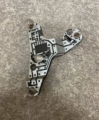 Tail light bulb cover holder