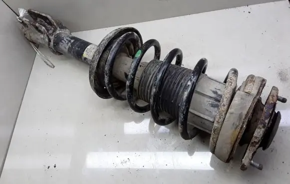 Opel Corsa B Front shock absorber with coil spring 90538712