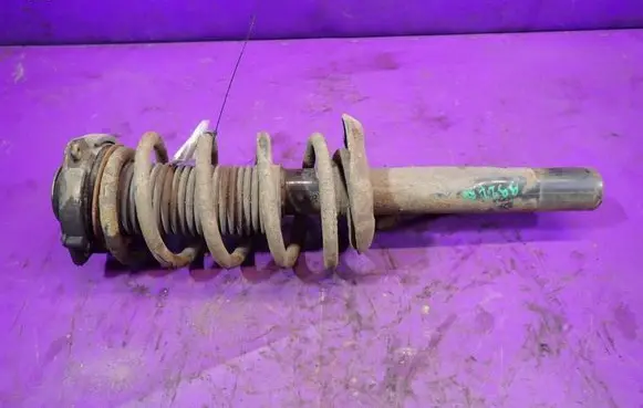Volkswagen Caddy Front shock absorber with coil spring