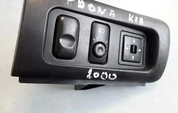KIA Sedona Headlight level height control switch