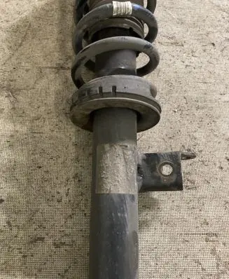 Front shock absorber with coil spring