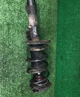 Front shock absorber with coil spring