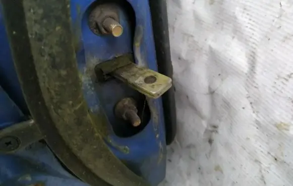 Mazda 323 Rear door check strap stopper