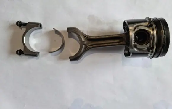 Piston with connecting rod