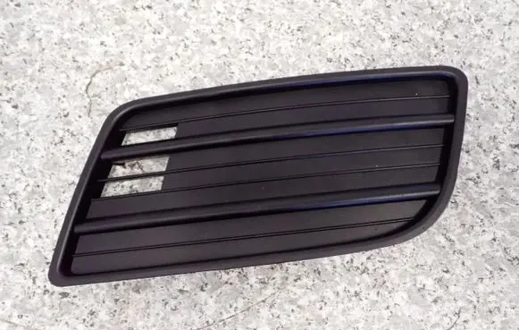 Suzuki Swift I Front fog light trim/grill 