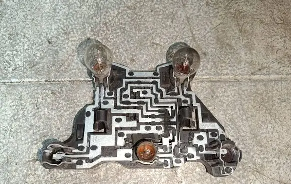 Tail light bulb cover holder