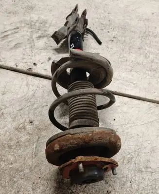Nissan X-Trail T30 Front shock absorber with coil spring 757125 290188GWU JGM1185T