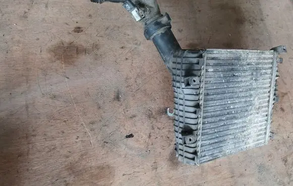 Volkswagen Touareg I Intercooler radiator 7L0145804A