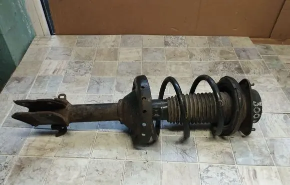 Subaru Outback Front shock absorber with coil spring