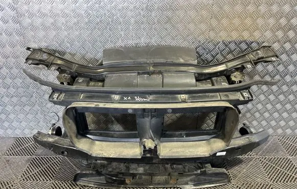 Radiator support slam panel