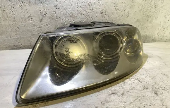 Volkswagen Touareg I Headlight/headlamp 7L6941015BK 89307851 1802A5394