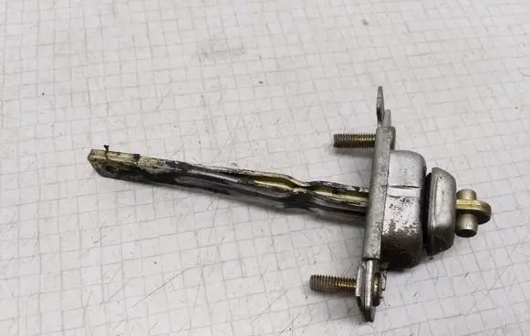 Mazda 323 F Front door check strap stopper