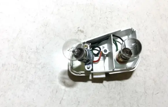 Mazda 626 Tail light bulb cover holder 0431397