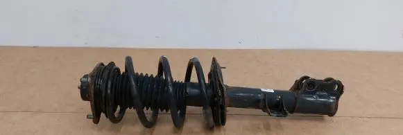 KIA Sportage Front shock absorber with coil spring 546503U500