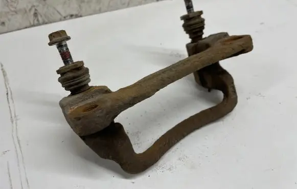 Subaru Forester SG Brake caliper pad carrier rear 
