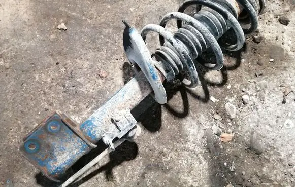 Peugeot Partner Front shock absorber with coil spring