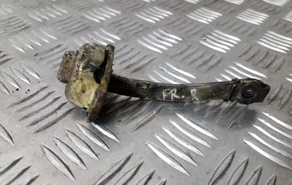 Front door check strap stopper