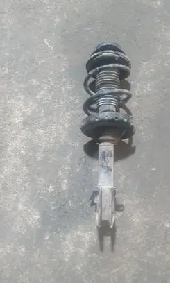 Subaru Outback Front shock absorber with coil spring