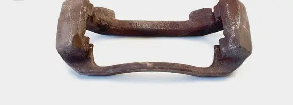 Dodge RAM 1500 DR Front Brake Caliper Pad/Carrier 14001001