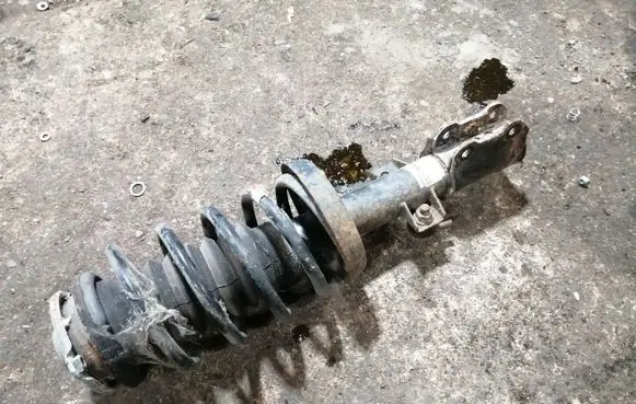 Saab 9-5 Front shock absorber with coil spring 5234182