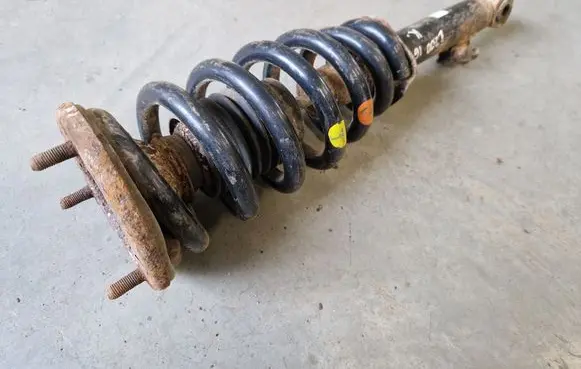Front shock absorber with coil spring