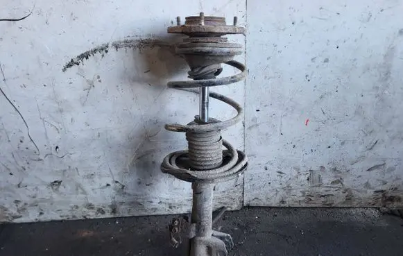 Front shock absorber with coil spring