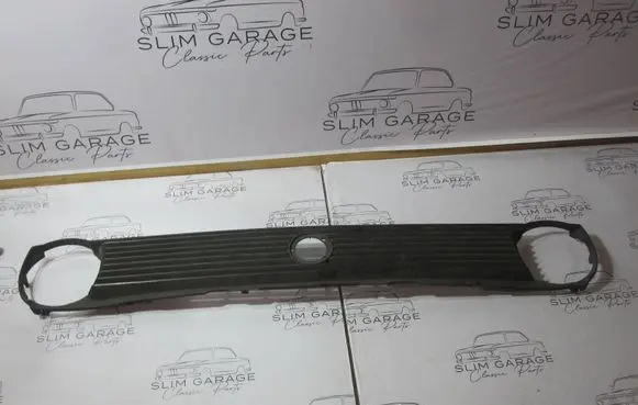 Volkswagen Polo II 86C 2F Front bumper upper radiator grill 867853653B