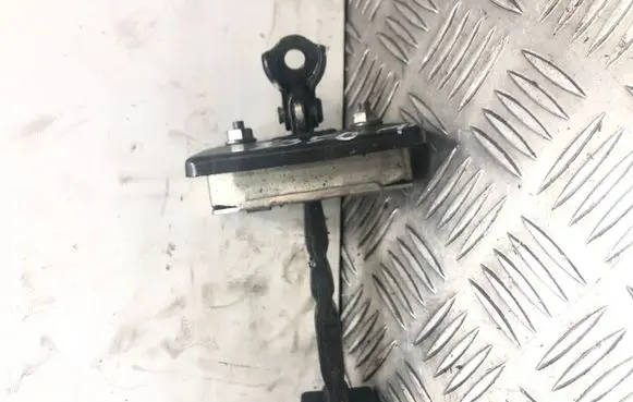 Front door check strap stopper