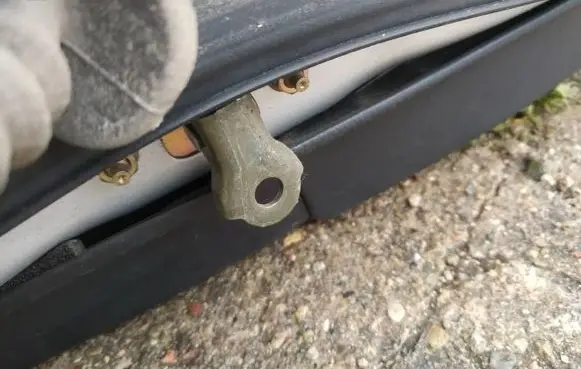 Subaru Legacy Rear door check strap stopper