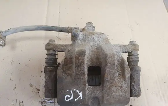 Suzuki Grand Vitara II Front brake caliper
