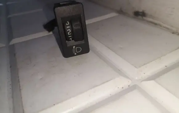 Headlight level height control switch