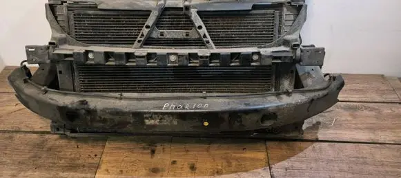 Radiator support slam panel