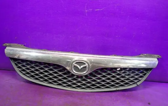 Mazda 626 Front bumper upper radiator grill GE4T50712
