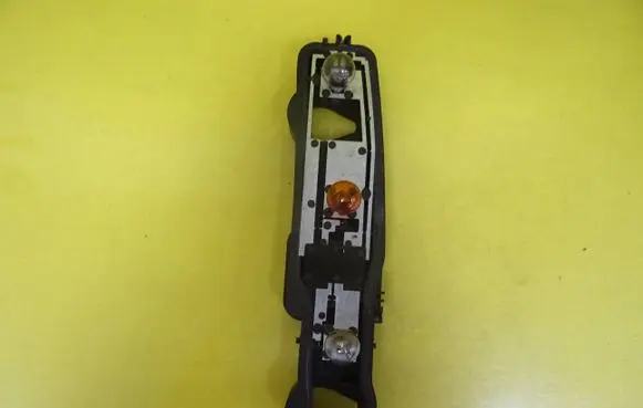 Tail light bulb cover holder