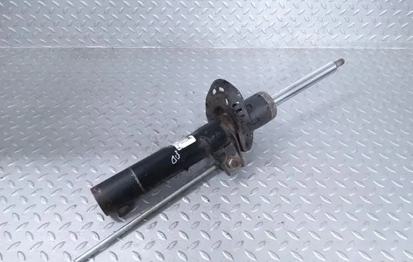 Volkswagen PASSAT B7 USA Front shock absorber/damper 561413031L