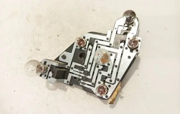 Tail light bulb cover holder