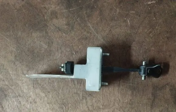 Front door check strap stopper
