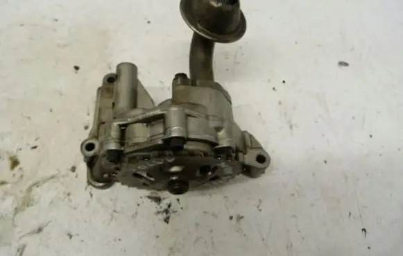 Volkswagen PASSAT B5 Oil sump strainer pipe 06A115105B