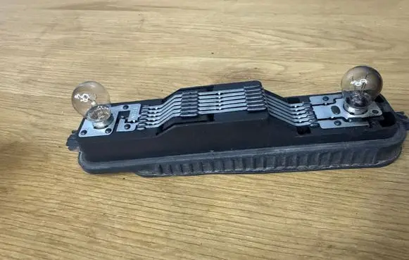 Opel Vivaro Tail light bulb cover holder 25467008