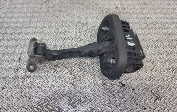 Front door check strap stopper