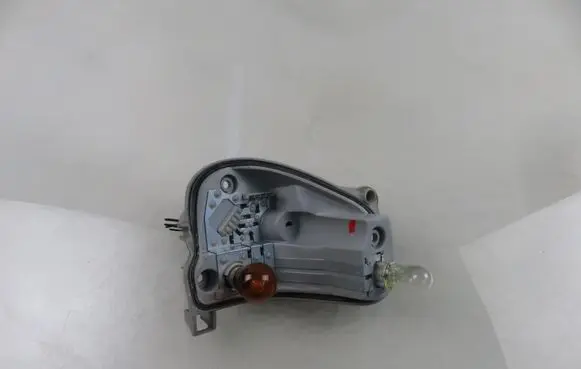 Tail light bulb cover holder