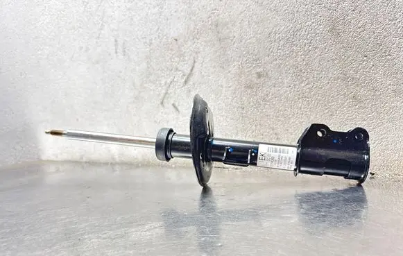 Opel Corsa D Front shock absorber/damper 13214360