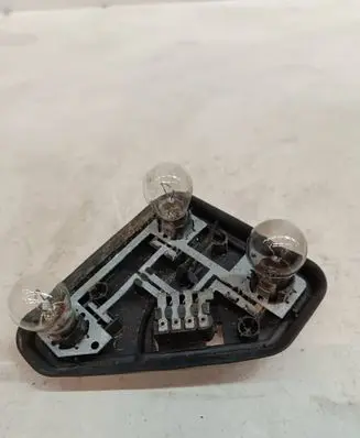 Tail light bulb cover holder