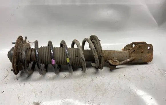 Front shock absorber with coil spring